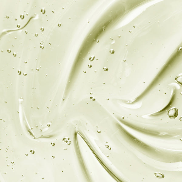 Close-up of the Gel Body Cleanser's silky gel texture with suspended green bubbles.