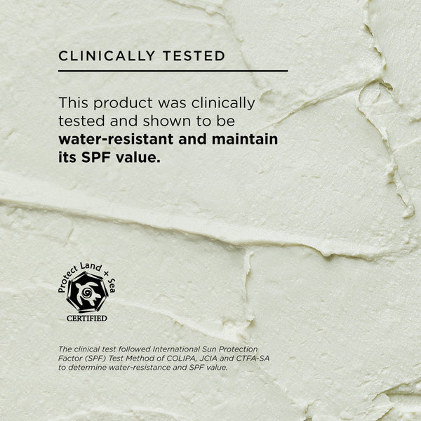 Text on a pale textured cream background reading “Clinically Tested – This product was clinically tested and shown to be water-resistant and maintain its SPF value.” Includes a Protect Land + Sea certified logo and fine print explaining SPF test methodology.