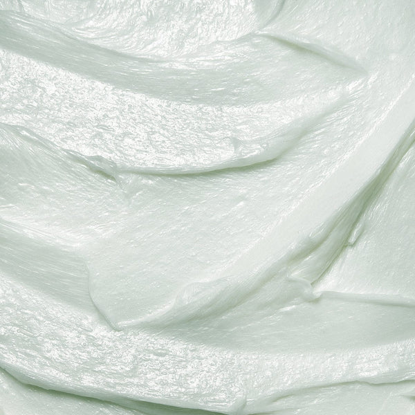 Smooth, light mint-green creamy texture of Tropic Rinse and Retreat Sensitive Body Wash, showing its rich, hydrating consistency.