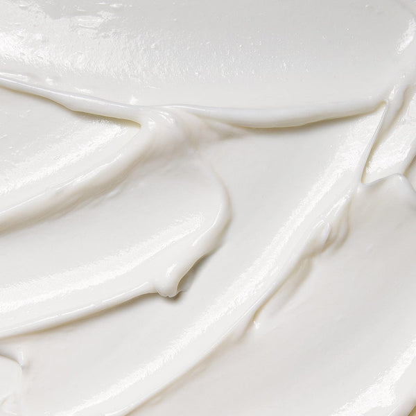 Close-up texture of Tropic Hair Feast Deep Conditioning Treatment, showing its rich, creamy consistency that smooths and nourishes hair.