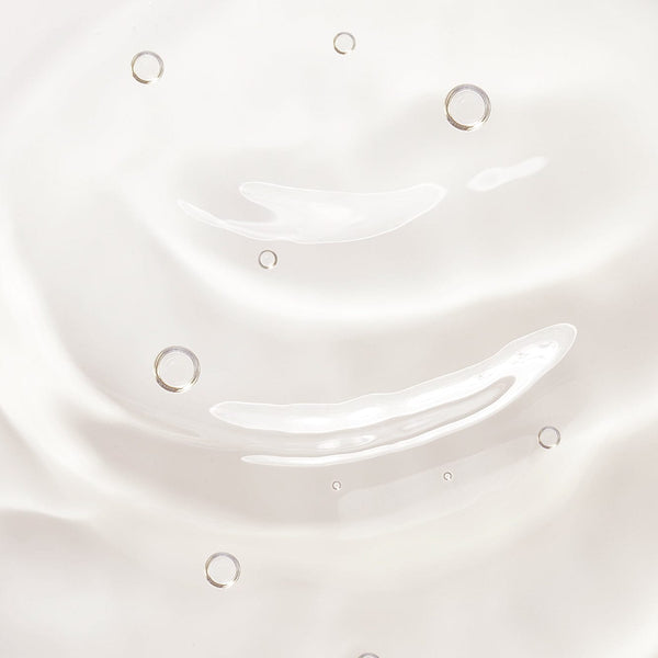 Close-up of a clear gel texture with smooth ripples and air bubbles, representing the lightweight, cleansing formula of Tropic Keep It Clean Hand Sanitiser.