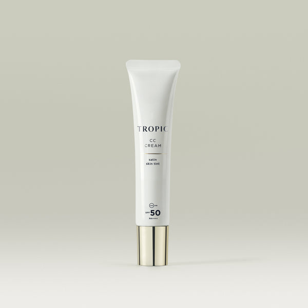 Tropic CC Cream Satin Skin Tint in a sleek white tube with a metallic cap, featuring SPF 50 protection.