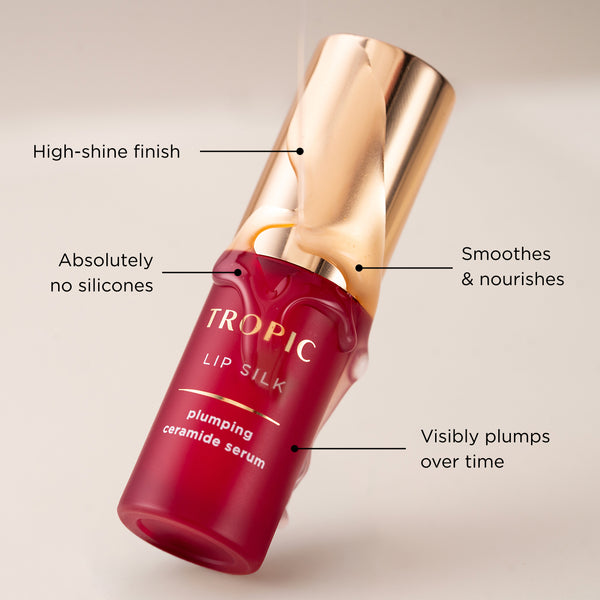 A Tropic Lip Silk serum bottle highlighting high-shine, no silicones, nourishing, and plumping benefits.
