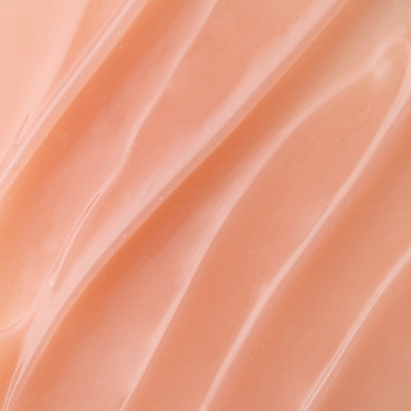 Close-up of smooth, peach-colored fabric texture