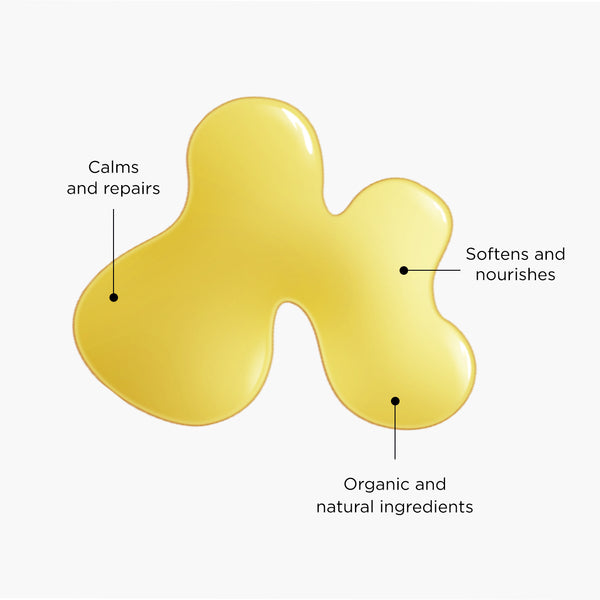 Golden-yellow baby oil texture swatch with labels highlighting benefits: calms and repairs, softens and nourishes, and organic and natural ingredients.