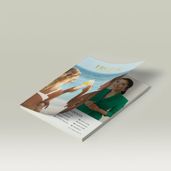 Tropic Beauty Brochure open with the cover showing two women on a beach holding skincare products, highlighting a sunlit, lifestyle-focused “People Issue” theme.