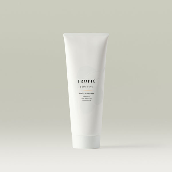 White Tropic tube labelled “Body Love,” a firming buttercream with shea butter, pink peppercorn, and vitamin E, displayed on a neutral background.