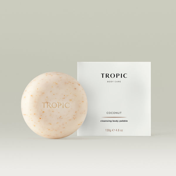 Tropic coconut cleansing body pebble and packaging on a light gray background