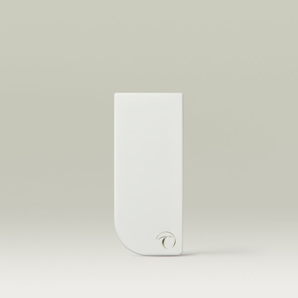 A tall, white rectangular makeup palette case with a rounded bottom-left corner and a small minimalist logo near the base, standing upright against a soft neutral background.