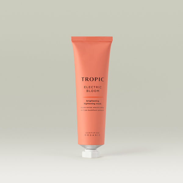 Tropic Electric Bloom brightening tightening mask. Agave nectar, electric daisy and sea buckthorn extracts. Pink aluminium tube with white piercer cap.