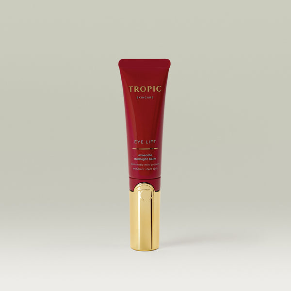 Tropic Skincare Eye Lift Exosome Midnight Balm in a sleek red and gold 