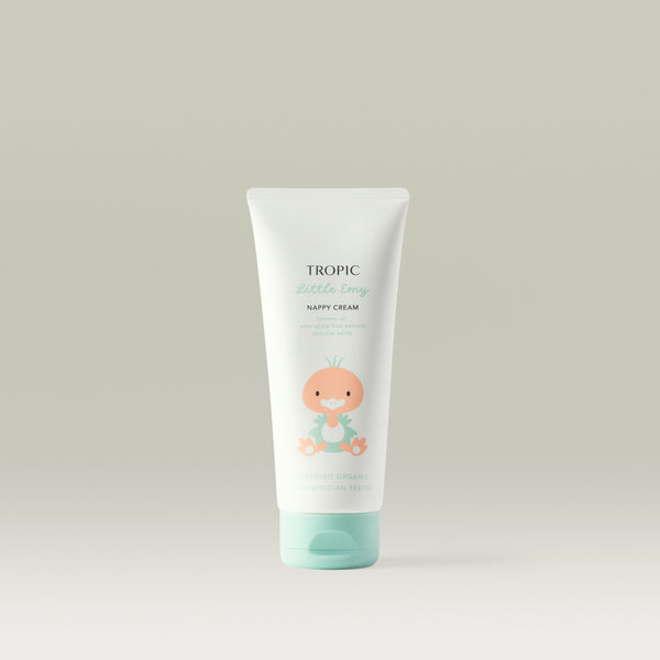Tropic Little Emy Nappy Cream in a soft white and mint green tube featuring a cute illustrated baby character on the front, standing upright against a neutral background.