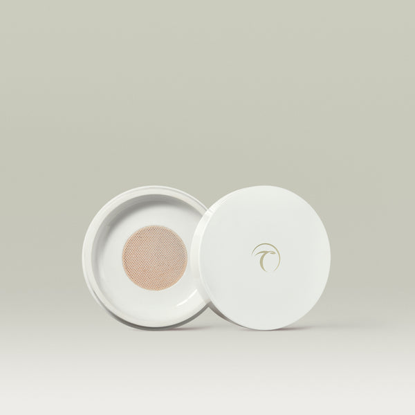 White compact with the lid open, revealing a mesh dispenser filled with loose mineral foundation in shade 1.