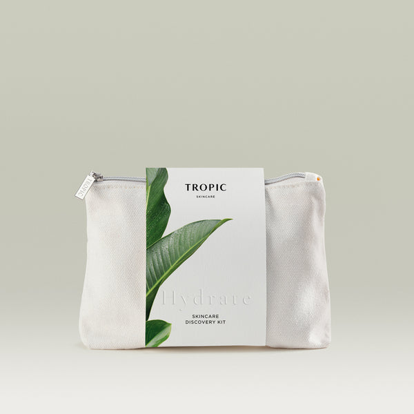 Tropic Skincare Discovery Kit – Hydrate edition, shown in a white zip travel bag with a label featuring a green tropical leaf design.