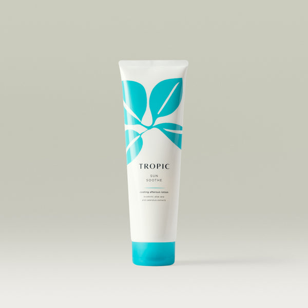 Tropic Sun Soothe cooling aftersun lotion in a white and turquoise tube with leaf design, featuring aloe vera and calendula extracts.