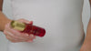 Model shakes Youth Potion bottle to activate the dual phase of the product and disperses into their hands. They then gently pat onto their face and into the skin.